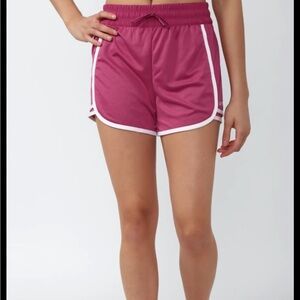 Women's Pink Athletic Dolphin Shorts with Contrast Trim Used, in good condition